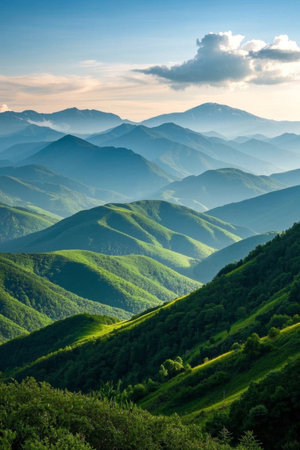 Continuous green mountains and blue sky and white clouds landscapeの素材