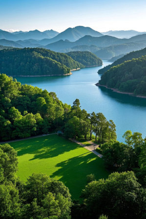 Panoramic view of natural scenery among green mountains and green watersの素材