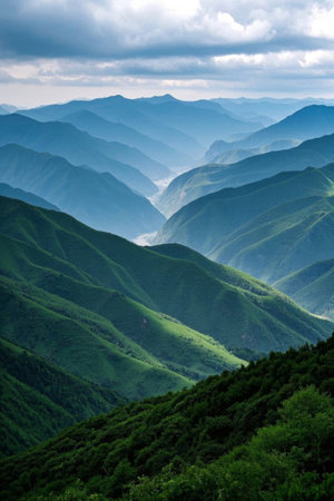 Panoramic view of the natural scenery of the continuous green mountainsの素材
