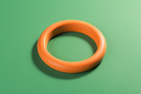 Orange round object on green backgroundの素材