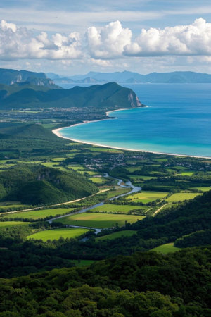 Overlooking the green fields and beaches between mountains and seaの素材
