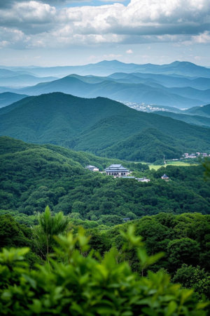 A distant view of the mountain and forest buildingsの素材