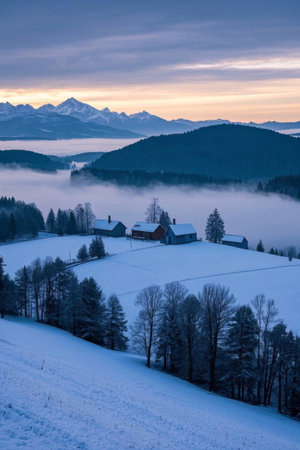 Winter countryside snow scene under the snow-capped mountainsの素材