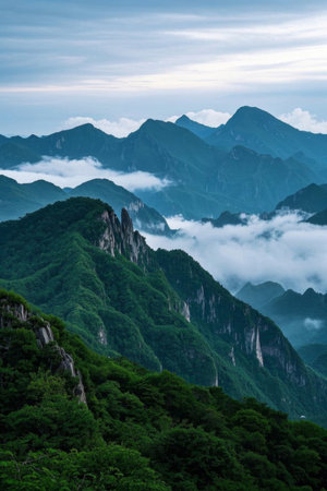 Mist-shrouded green mountain landscapeの素材