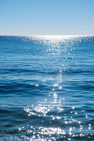 A blue ocean sparkling in the sunの素材