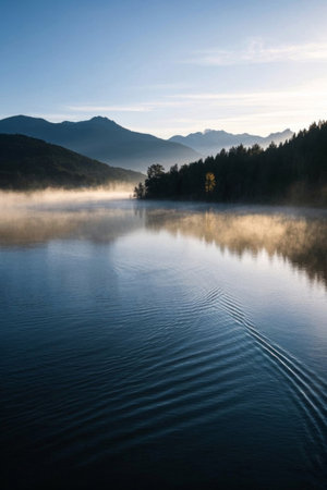 Morning misty lake scenery among mountains and riversの素材
