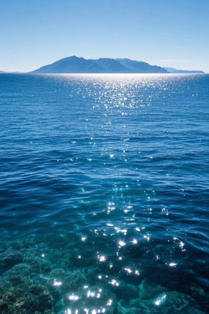 Blue ocean and distant mountain landscapeの素材