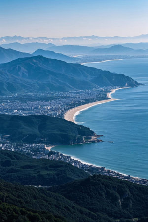 Overlooking the landscape of the coastal city between mountains and seaの素材