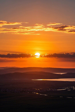 Panoramic view of mountains, rivers and lakes at sunsetの素材