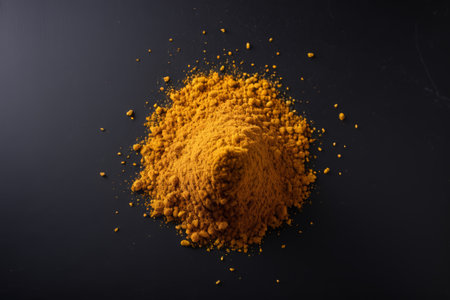Pile of spice powder on black backgroundの素材