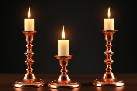 Burning candles and copper candlesticksの素材