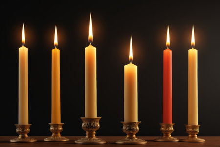 Laying multiple lit candles togetherの素材