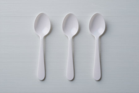 Close-up of three white spoonsの素材