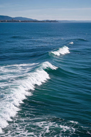 The blue ocean surges with white wavesの素材