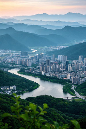 Panoramic view of the city surrounded by mountains and riversの素材