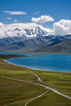 Lakes and winding roads under the snow-capped mountainsの素材
