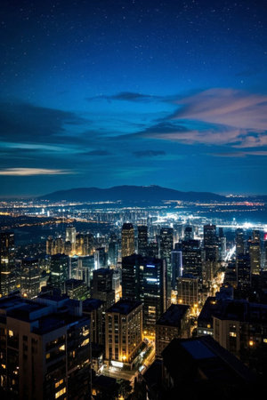 City night view of high-rise buildings and starry sky panoramaの素材