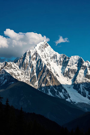 Towering snow-capped mountains and blue sky landscapeの素材