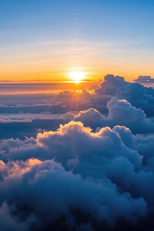 Sunrise scene above the sea of clouds high in the skyの素材