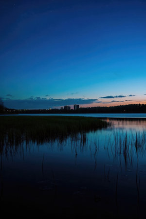 Dusk sky by the lake and city viewの素材