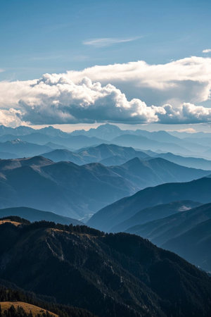 Mountain landscape under blue sky and white cloudsの素材