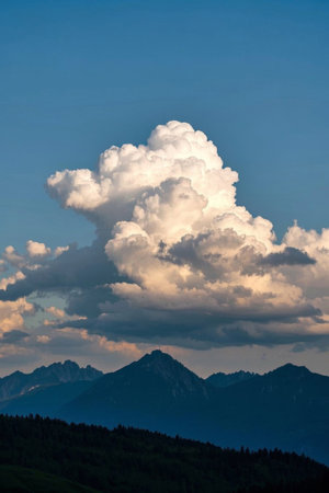 Mountain landscape under blue sky and white cloudsの素材