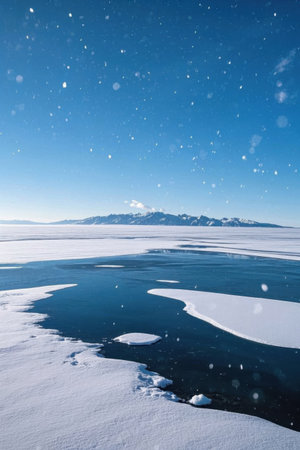 Snow covered outdoor lakes and distant mountain landscapesの素材