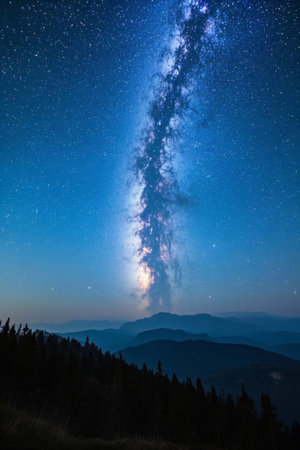 The dazzling Milky Way under the mountain night skyの素材