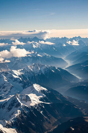 Aerial view of the snow capped mountains and sea of cloudsの素材