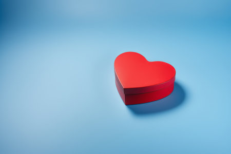Red heart gift box with blue backgroundの素材