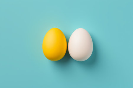 Yellow and white eggs on a blue backgroundの素材