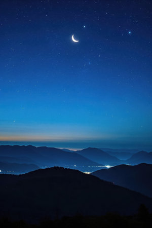 Continuous mountains and starry moon landscape under the night skyの素材