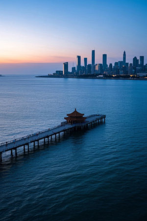 Pier and high rise buildings at dusk in a seaside cityの素材