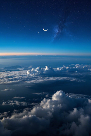 Looking down at the sea of clouds and the night sky of stars and moon from aboveの素材