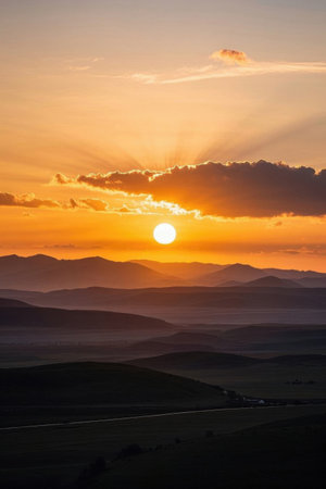 Distant mountains and sky at sunsetの素材