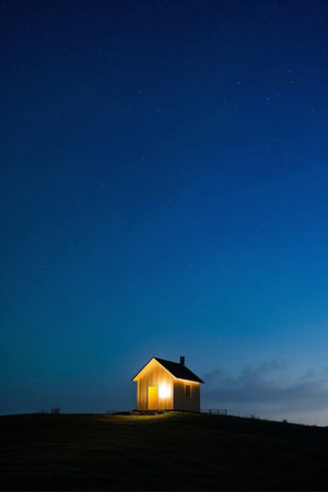 Lighted hut under the starry sky at nightの素材