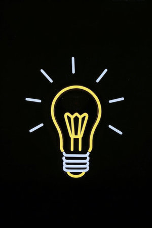 Neon light bulb pattern on black backgroundの素材