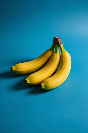 Bunches of bananas on a blue backgroundの素材