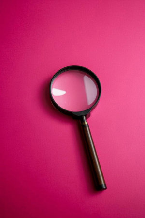 Magnifier on rose red backgroundの素材