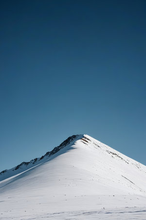 Snowy mountain scenery covered by blue skyの素材