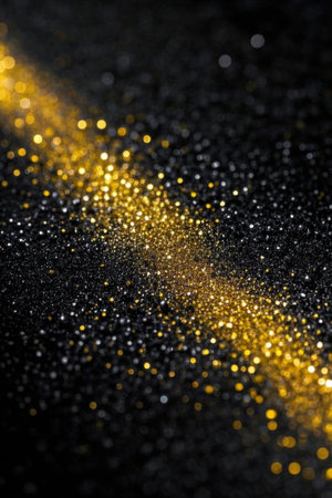 Gold Glow Particles on Black Backgroundの素材