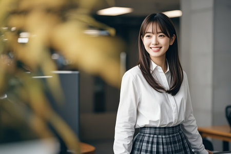 Asian woman smiling in the officeの素材