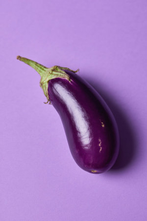 Fresh eggplant on purple backgroundの素材