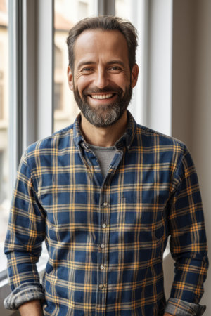 Smiling man's bust by the windowの素材