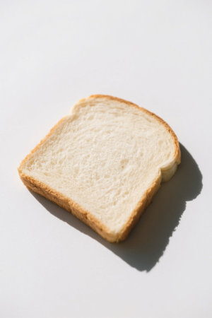 Close-up of a single slice of white breadの素材