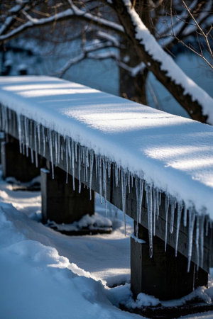 Snow covered benches and ice covered outdoor scenesの素材
