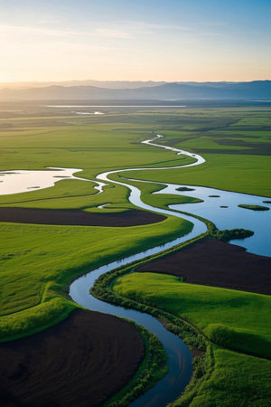 Aerial photography of the winding river landscape of the grasslandの素材