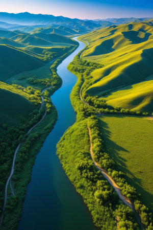 Aerial photography of winding rivers and green hillsの素材