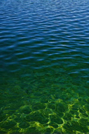 Clear blue water surface and underwater sceneの素材