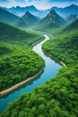 Winding river landscape among green mountains and green watersの素材